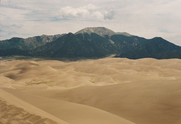View of the Sangre de Cristo Mountains from High Dune, the second highest star dune in the dune field. The altitude at the top of the dune is near 9000 feet above sea level.